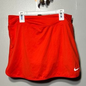 Bright orange Nike tennis skirt